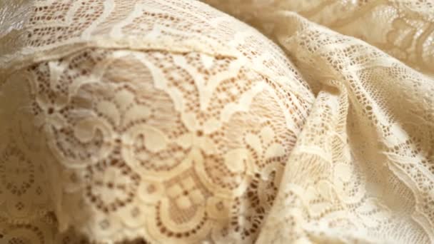 Fabric background. beige lace pattern. texture, close-up — Stock Video