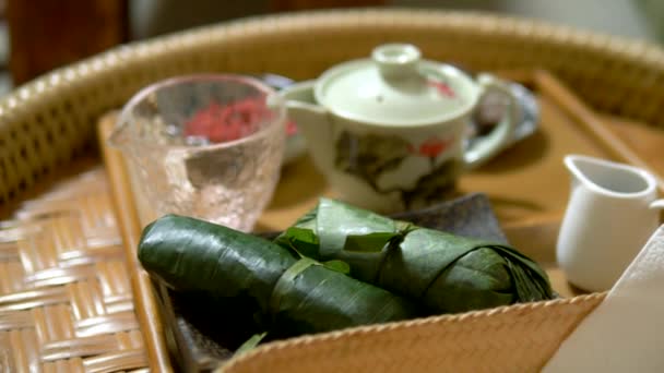 Diet food concept, vegetarianism. rice with mushrooms and peanuts in banana leaves and goji berries on the table. chinese cuisine — Stock Video