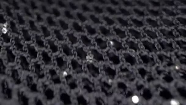 Makro. textilní pozadí. pohyb černé guipure tkaniny s lurex — Stock video