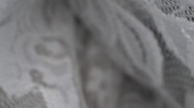 Makro. Tekstil arka planı. Dantel kumaş kıvrımları