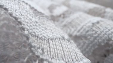 Makro. Tekstil arka planı. Dantel kumaş kıvrımları