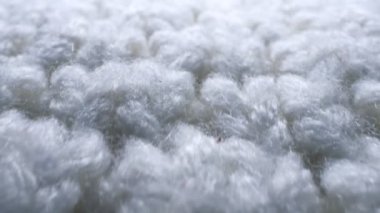 Makro. Tekstil arka planı. beyaz yün örgü kumaş dokusu