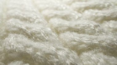 Makro. Tekstil arka planı. beyaz yün örgü kumaş dokusu