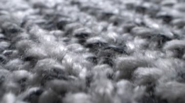 Süper yakın çekim. Gri örülmüş yün kumaşın detayları. tekstil arkaplanı
