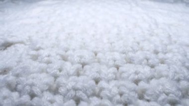 Makro. Tekstil arka planı. beyaz yün örgü kumaş dokusu