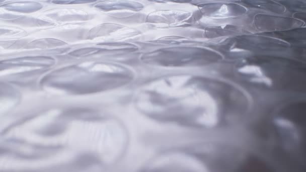 Super close up. elements of packaging cellophane material with bubbles — Stock Video