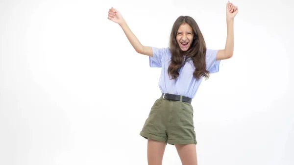 Isolated white background. beautiful teenager girl in shorts is dancing — Stock Photo, Image