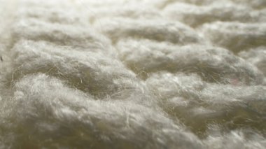 Makro. Tekstil arka planı. beyaz yün örgü kumaş dokusu
