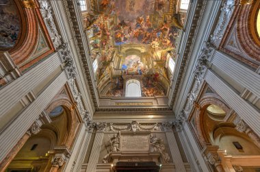 Rome, Italy - March 24, 2018: The beautifully painted ceiling and dome of the Church of Saint Ignatius of Loyola in Rome, Italy. clipart