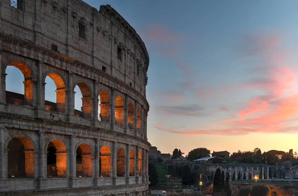 Ancient Roman Colosseum at sunset in Rome, Italy.