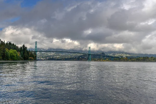 Lions Gate Bridge as seen from Stanley Park in  Vancouver, Canada. The Lions Gate Bridge, opened in 1938, officially known as the First Narrows Bridge, is a suspension bridge.