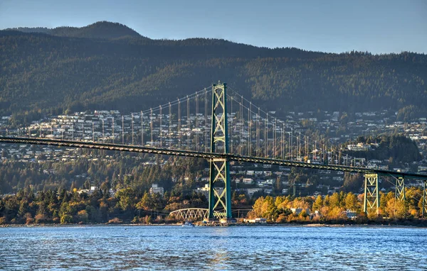 Lions Gate Bridge as seen from Stanley Park in  Vancouver, Canada. The Lions Gate Bridge, opened in 1938, officially known as the First Narrows Bridge, is a suspension bridge.