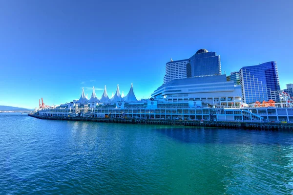 Canada Place and commercial buildings in Downtown Vancouver along Vancouver Harbour.