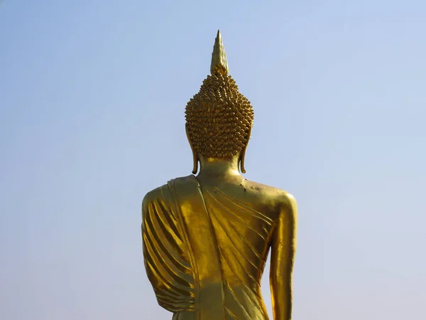 The back side of the buddha statue with the blue sky background. The buddha statue is famous at the north of Thailand