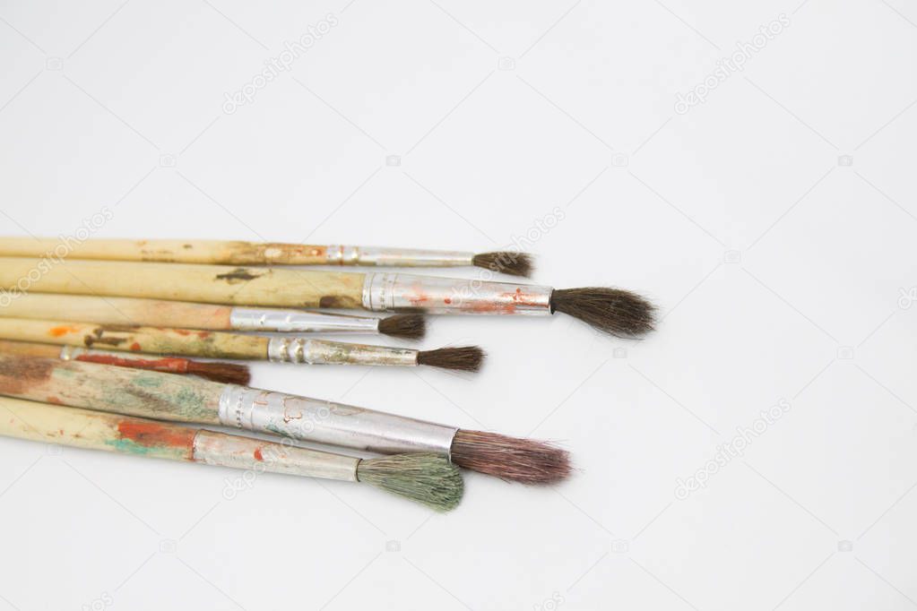 Paint brushes and paints for drawing isolated on white background