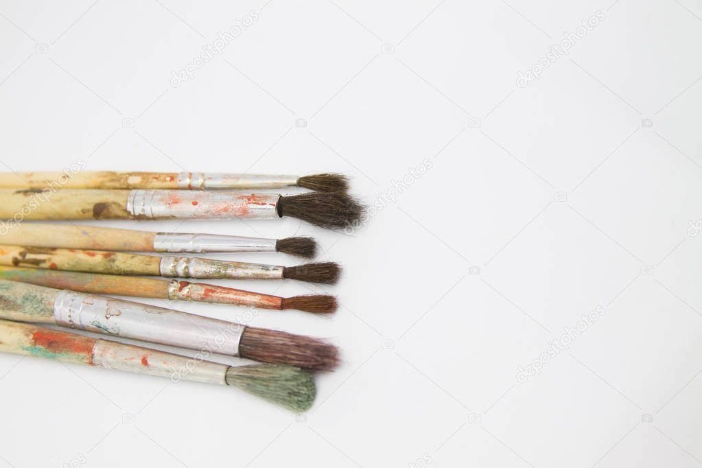 Paint brushes and paints for drawing isolated on white background