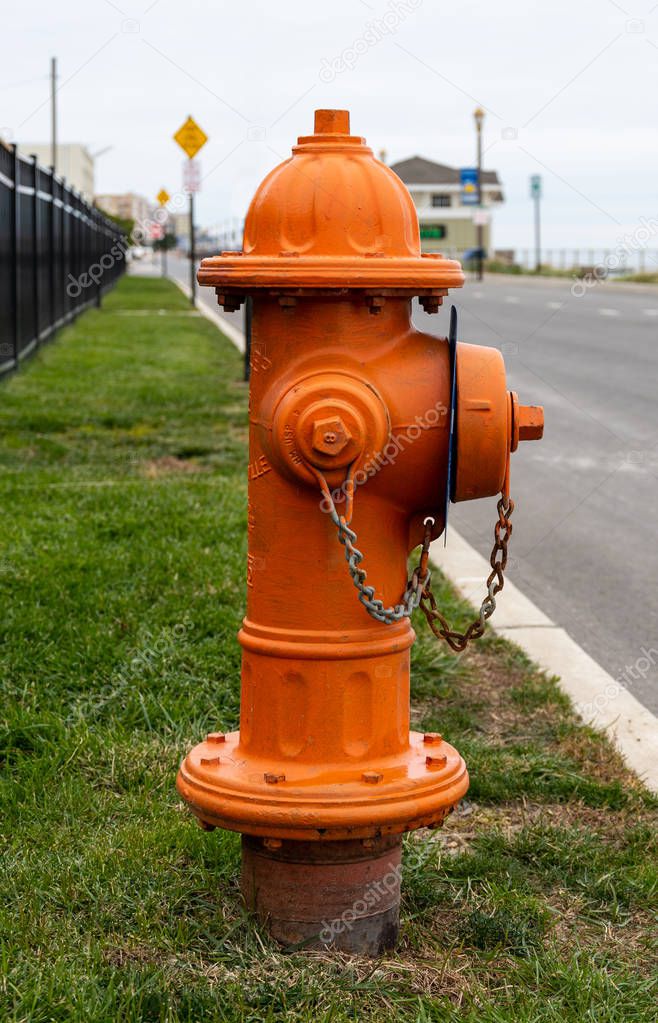 A photo of an Orange Fire Hydrant on the coast road in Long Branch