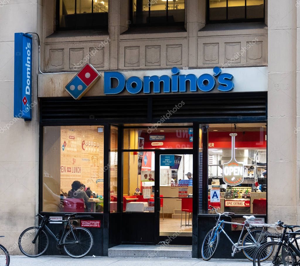 New York City, United States - November 17 2018:   The frontage of Dominos Pizza take away shop on West 40th Street