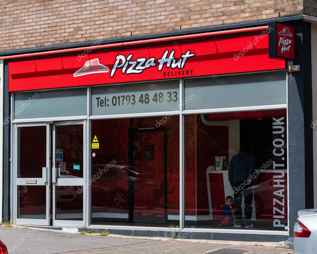 Swindon, United Kingdom - May 04 2019:   The entrance to Pizza Hut fast food delivery shop in Lincoln Street