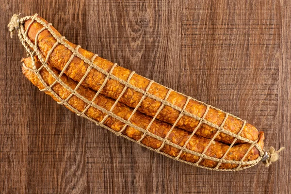 Group Two Whole Dry Smoked Ham Sausage Flatlay Brown Wood — Stock Photo, Image