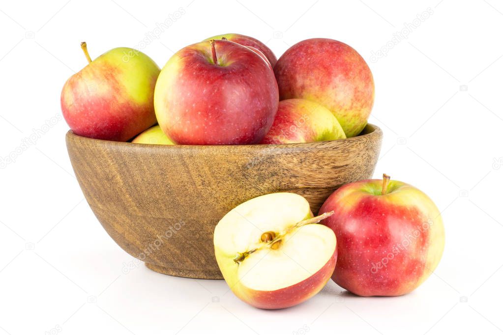 Lot of whole one half of fresh red apple james grieve variety with wooden bowl isolated on white background