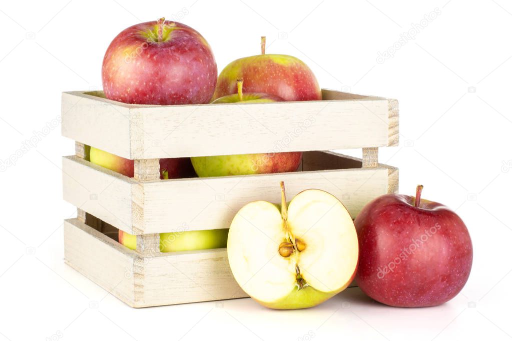 Lot of whole one half of fresh red apple james grieve variety with wooden crate isolated on white background