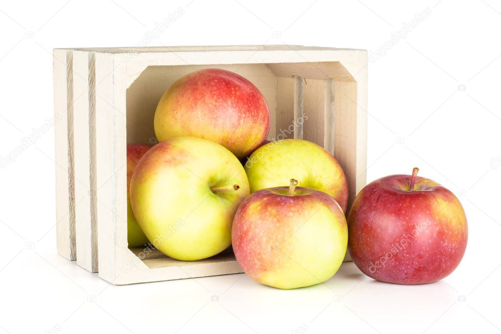 Lot of whole fresh red apple james grieve variety with wooden crate isolated on white background