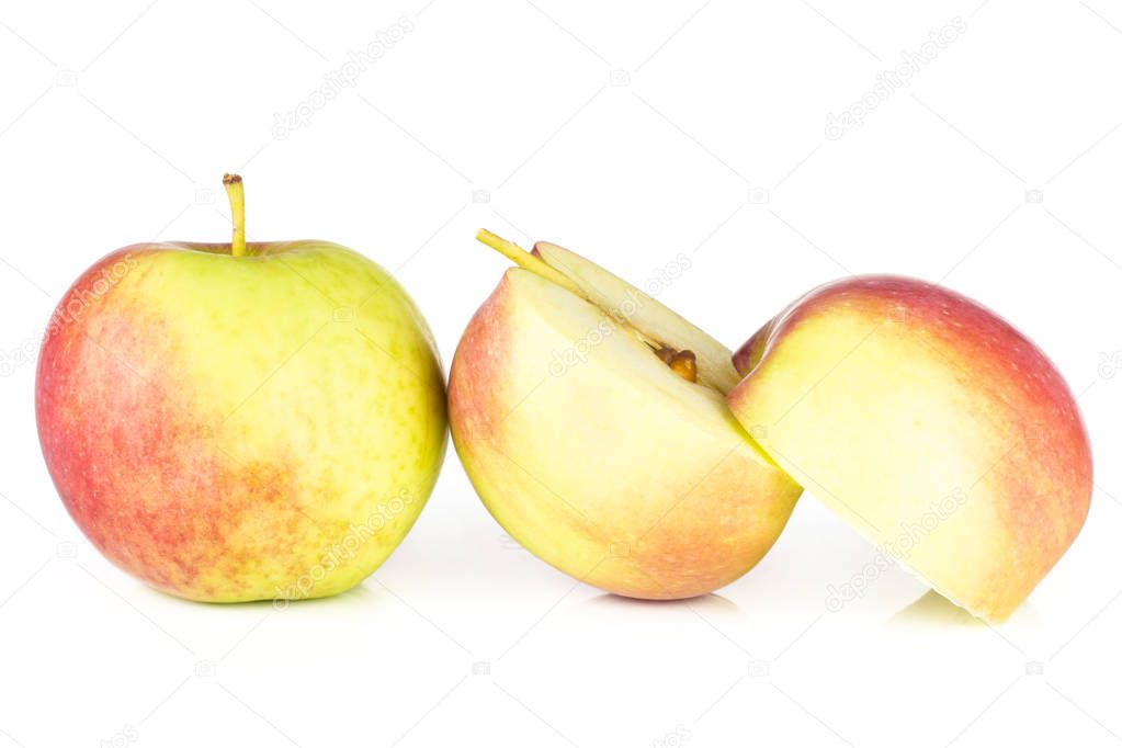 Group of one whole two halves of fresh red apple james grieve variety isolated on white background