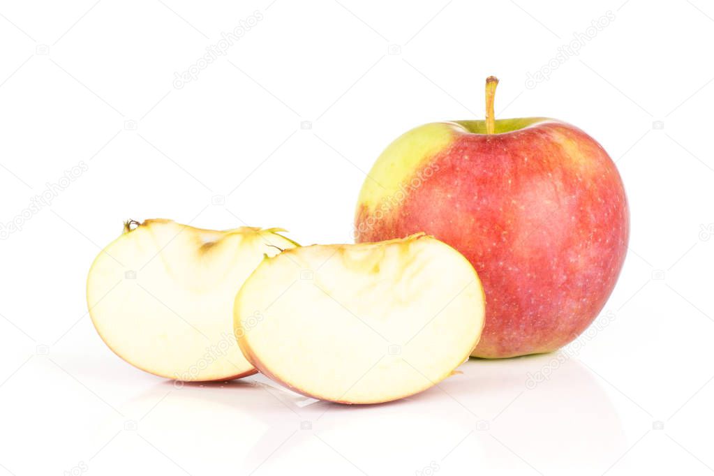 Group of one whole two slices of fresh red apple james grieve variety isolated on white background