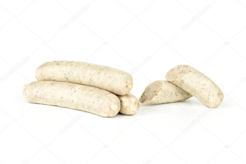 Group of three whole two halves of bavarian white sausage isolated on white
