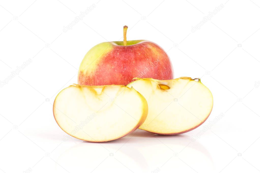 Group of one whole two slices of fresh red apple james grieve variety isolated on white background