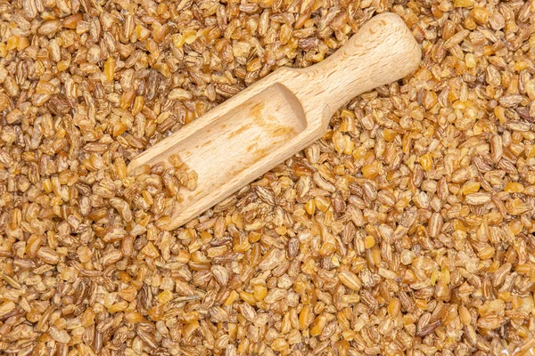 Raw bulgur grains isolated — Stock Photo, Image