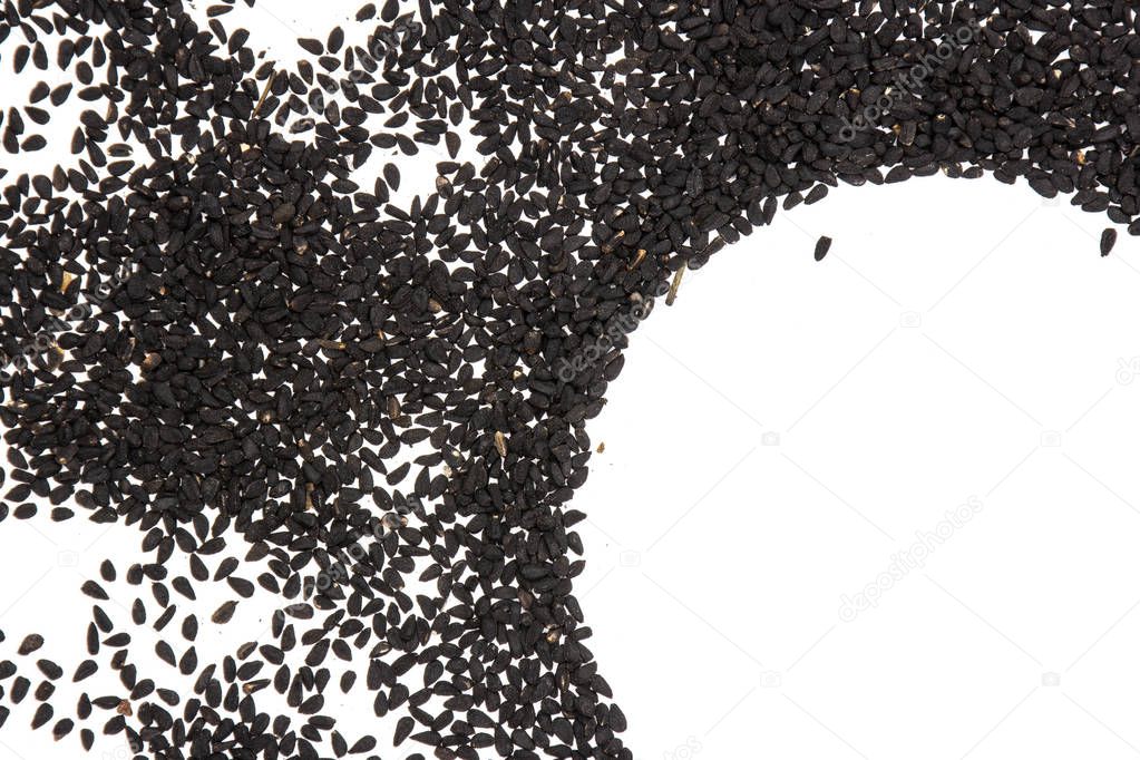 Black cumin seeds isolated on white