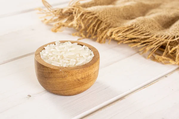 White jasmine rice on grey wood — 스톡 사진
