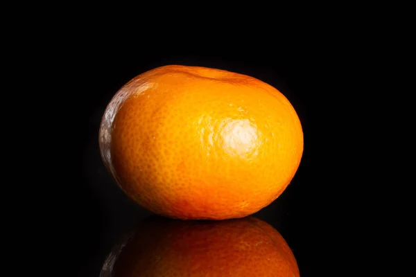 Mandarine with a leaf isolated on black glass — Stock Photo, Image