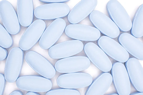 Blue medical pills isolated on white — Stock Photo, Image