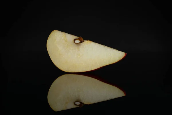 Anjou red pear isolated on black glass — Stock Photo, Image