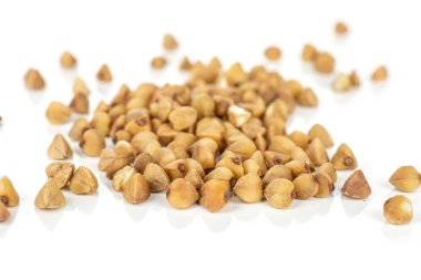 Raw buckwheat grain isolated on white clipart