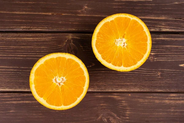 Sweet orange on brown wood — Stock Photo, Image