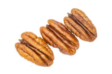 Fresh pecan nut isolated on white clipart
