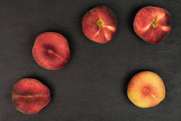 Fresh paraguay peach on grey stone — Stock Photo, Image