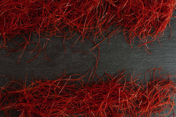 Red chili threads on grey stone