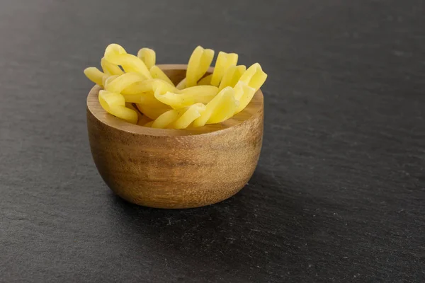 stock image Raw pasta gemelli on grey stone