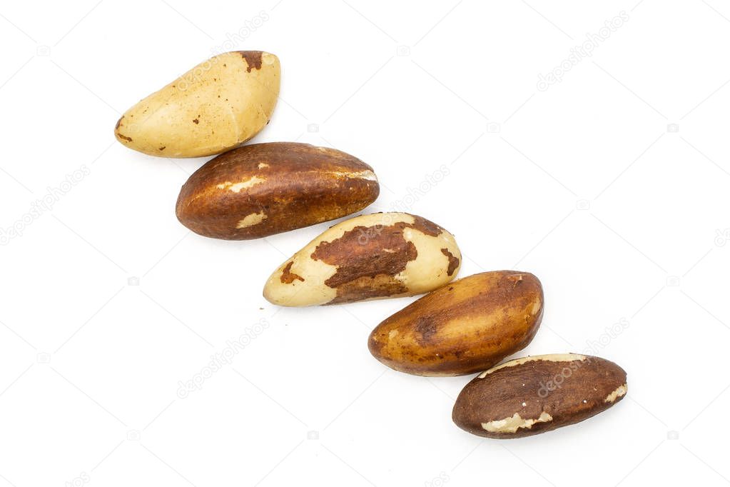 Unshelled brazil nut isolated on white