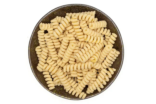 Pâtes alimentaires crues fusilli bucati isolées sur blanc — Photo