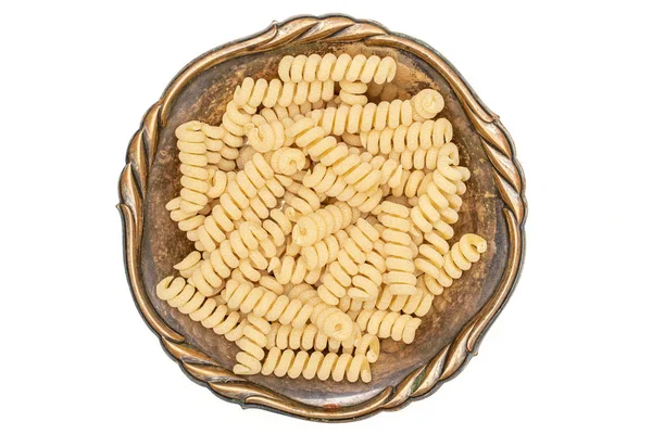 Těstoviny Fusilli bucati izolované na bílém — Stock fotografie