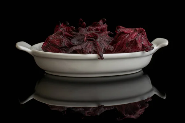 Candied hibiscus isolated on black glass — Stock Photo, Image