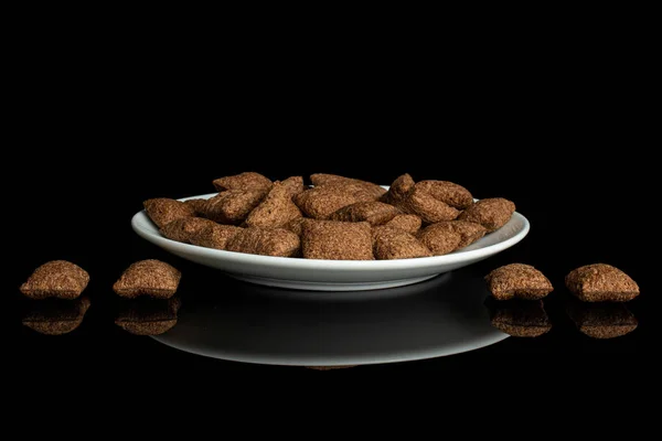 Almohada de cereal crujiente aislada en vidrio negro — Foto de Stock