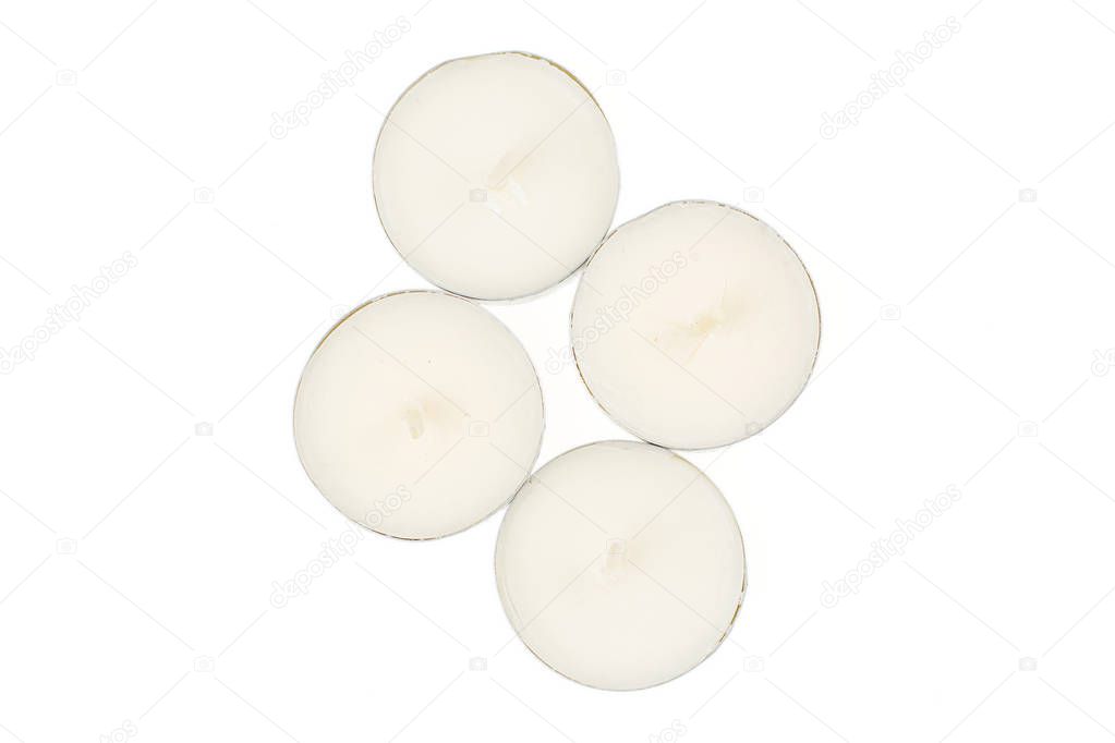 Waxy tea candle isolated on white