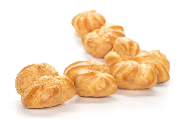 Gouden gebakken profiterole geïsoleerd op wit — Stockfoto